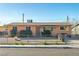 Simple single-story home with gravel front yard and chain link fence at 1805 Helen Ave, North Las Vegas, NV 89032