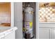 Water heater inside kitchen closet at 1805 Helen Ave, North Las Vegas, NV 89032