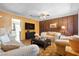 Bright and open living room with a flat-screen TV, comfortable seating, and a seamless transition to an adjacent room at 1805 Helen Ave, North Las Vegas, NV 89032