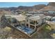 Aerial view of the home with its stunning backyard pool, patio, and neighborhood setting against a mountain backdrop at 1968 Regal Bluff Dr, Henderson, NV 89052