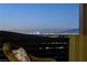 Balcony view showcasing the city skyline with lights twinkling against the dark sky at 1968 Regal Bluff Dr, Henderson, NV 89052