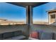 This balcony features mountain views and comfortable seating at 1968 Regal Bluff Dr, Henderson, NV 89052