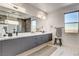 Bathroom with a glass enclosed shower, double vanity, and modern fixtures at 1968 Regal Bluff Dr, Henderson, NV 89052