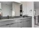 Bathroom with a double vanity, modern fixtures, and floating mirrors at 1968 Regal Bluff Dr, Henderson, NV 89052