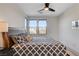 Cozy bedroom features natural light, wood-look flooring, and dark furniture at 1968 Regal Bluff Dr, Henderson, NV 89052