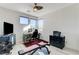 Bedroom with a ceiling fan, three windows, and hard wood floors at 1968 Regal Bluff Dr, Henderson, NV 89052