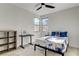 Bedroom with a ceiling fan, two windows, and hard wood floors at 1968 Regal Bluff Dr, Henderson, NV 89052