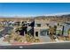Attractive two-story home with desert landscaping and a brick-paved driveway at 1968 Regal Bluff Dr, Henderson, NV 89052