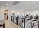 Hallway featuring modern black and silver railings, with a view of the downstairs at 1968 Regal Bluff Dr, Henderson, NV 89052