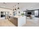 Bright, modern kitchen features large island, stainless steel appliances, and open floor plan at 1968 Regal Bluff Dr, Henderson, NV 89052
