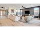 Bright living room with stylish decor, light wood floors, and patio access at 1968 Regal Bluff Dr, Henderson, NV 89052