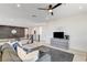 Upstairs living room featuring a modern couch, television and views of the staircase and hallway at 1968 Regal Bluff Dr, Henderson, NV 89052