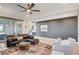 Spacious living room with modern decor, hardwood floors, and an inviting atmosphere perfect for relaxation at 1968 Regal Bluff Dr, Henderson, NV 89052