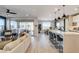 Open living room and kitchen area with modern finishes and ample natural light at 1968 Regal Bluff Dr, Henderson, NV 89052