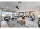 Bright living room showcasing light wood floors, access to patio, and open layout at 1968 Regal Bluff Dr, Henderson, NV 89052