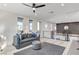 Upstairs living area with a view of the downstairs with a staircase and black metal railing at 1968 Regal Bluff Dr, Henderson, NV 89052