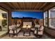 Cozy covered patio features comfortable seating with a water feature, providing the perfect spot for relaxation at 1968 Regal Bluff Dr, Henderson, NV 89052