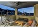 Relaxing covered patio features comfortable seating and a stunning view of the surrounding hillside neighborhood at 1968 Regal Bluff Dr, Henderson, NV 89052