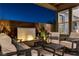 Inviting covered patio with cozy seating, a modern water feature and stylish decor at 1968 Regal Bluff Dr, Henderson, NV 89052