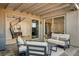 Inviting covered patio with comfortable seating, seamlessly connecting indoor and outdoor living at 1968 Regal Bluff Dr, Henderson, NV 89052