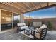 Charming covered patio featuring stylish outdoor seating, perfect for relaxing and entertaining at 1968 Regal Bluff Dr, Henderson, NV 89052