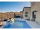 Inviting backyard pool and spa with elegant water feature and beautiful mountain views at 1968 Regal Bluff Dr, Henderson, NV 89052