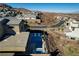 An aerial showcases a modern pool and spa, set amidst desert landscaping and upscale homes at 1968 Regal Bluff Dr, Henderson, NV 89052