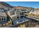 Beautiful two-story home featuring a private pool, patio, and mountain views at 1968 Regal Bluff Dr, Henderson, NV 89052