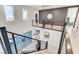 Staircase leading to the living room area with views of an office and an outdoor patio at 1968 Regal Bluff Dr, Henderson, NV 89052