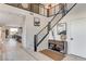 Contemporary staircase with sleek metal railings, hardwood floors, and modern decor at 1968 Regal Bluff Dr, Henderson, NV 89052