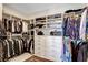 Well organized walk-in closet with custom shelving, drawers, and hanging racks at 1968 Regal Bluff Dr, Henderson, NV 89052