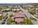 Stunning aerial view of a home featuring a red tile roof and lush landscaping at 2101 Strada Mia Ct, Las Vegas, NV 89117