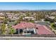 Expansive aerial view of the luxury property showcasing the tile roof, pool, and landscaped yard at 2101 Strada Mia Ct, Las Vegas, NV 89117