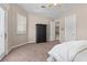 Bedroom featuring a queen bed, ceiling fan, and balcony access at 2101 Strada Mia Ct, Las Vegas, NV 89117