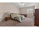 Spacious bedroom with a ceiling fan, a window with shutters and tan walls at 2101 Strada Mia Ct, Las Vegas, NV 89117