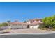Stately home boasting a six-car garage, a terracotta tile roof, and a circular driveway at 2101 Strada Mia Ct, Las Vegas, NV 89117