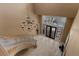 Grand foyer with elegant chandelier, curved staircase, and wrought iron front doors at 2101 Strada Mia Ct, Las Vegas, NV 89117