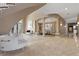 Expansive foyer with tiled floors, decorative columns, and open access to the dining area at 2101 Strada Mia Ct, Las Vegas, NV 89117