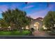 Charming single-story home with well-maintained landscaping and grand entrance with columns at 2101 Strada Mia Ct, Las Vegas, NV 89117