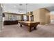 Spacious game room featuring a pool table, ceiling fan and plush carpet at 2101 Strada Mia Ct, Las Vegas, NV 89117