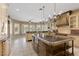 Large kitchen featuring custom cabinets with decorative molding, granite countertops, and stainless steel appliances at 2101 Strada Mia Ct, Las Vegas, NV 89117