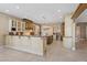 Expansive kitchen boasts a large island, custom cabinets, granite countertops, and modern appliances at 2101 Strada Mia Ct, Las Vegas, NV 89117
