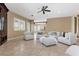 Bright living room features plush seating, recessed lights, a ceiling fan and neutral paint at 2101 Strada Mia Ct, Las Vegas, NV 89117