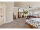 Expansive main bedroom featuring plush carpeting, dual windows with shutters, and custom built-in cabinets at 2101 Strada Mia Ct, Las Vegas, NV 89117