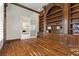 Office space boasts custom built-in shelving, hardwood floors, and a cozy atmosphere at 2101 Strada Mia Ct, Las Vegas, NV 89117