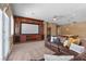 Relaxing theater room featuring a projector screen, custom lighting, and a leather couch at 2101 Strada Mia Ct, Las Vegas, NV 89117