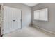 Bedroom featuring carpet, a window with blinds, and double closet doors at 2613 Country Mile Dr, Las Vegas, NV 89135