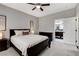 Cozy bedroom featuring a comfortable bed and ensuite bathroom for added privacy and convenience at 2613 Country Mile Dr, Las Vegas, NV 89135