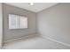 Bedroom with carpet, ceiling fan, a window, and neutral-colored walls at 2613 Country Mile Dr, Las Vegas, NV 89135