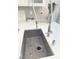 Close-up of kitchen sink featuring a modern faucet and undermount sink with grid at 2613 Country Mile Dr, Las Vegas, NV 89135